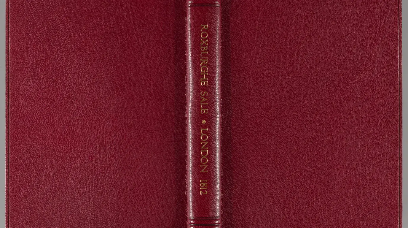 A red leather-bound copy of the Roxburghe sale catalogue, its spine lettered 'Roxburghe Sale · London · 1812'.